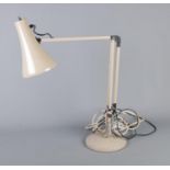 A grey angle poise adjustable table lamp.
