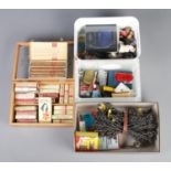 Four small boxes of assorted collectable items. To include cigar and cigarette packets, novelty