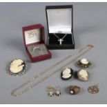 A collection of jewellery, including silver ring, crucifix on silver chain, cameo jewellery and
