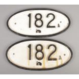 A pair of cast iron black on white railway plates; 182A. Height: 19cm, Width: 40cm. Has been