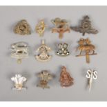 Twelve military cap badges including Jellalabad, 1st Vol. Battalion Leicestershire, The Suffolk