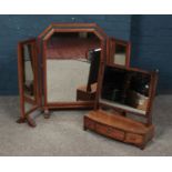 A large triple fold dressing table mirror along with a Victorian toilet mirror.