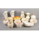 A quantity of Maling Lustre mostly in the Pink Blossom pattern. Includes biscuit barrel, jugs,
