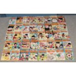 A large quantity of Beano magazine. Including 1970s, 80s and 90s examples. Some with original free