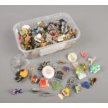 A large collection of pin badges, including enamel examples.