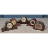 Five wooden cased mantel clocks. Mostly in need of repair or attention.