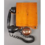 A railway signal box telephone with receiver and bell, stamped 'Gents' to front and with service