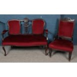 A carved mahogany part salon suite. Comprising of two seat sofa and chair.