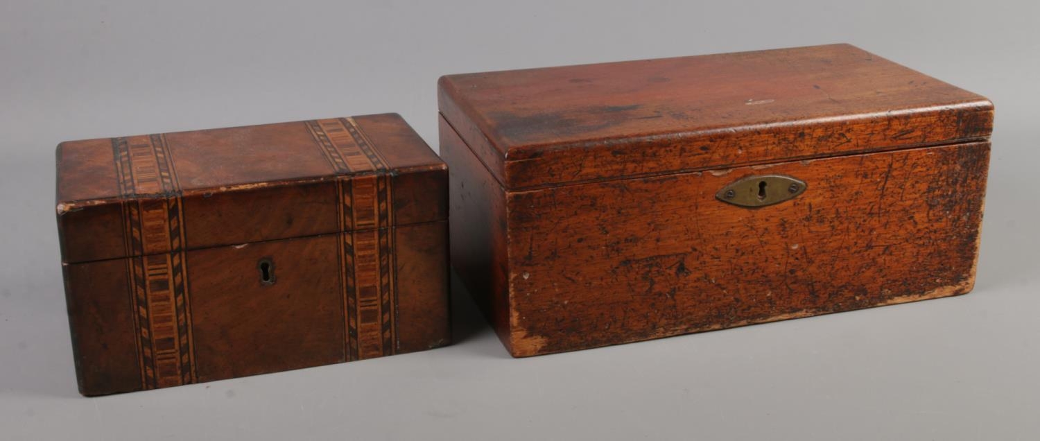 A Victorian mahogany tea caddy, together with a mahogany box with three removable trays. Box stamped