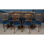 A set of eight gilt wood upholstered function chairs. Some of the chairs have splits to the wood.