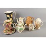 A quantity of jugs and teapots including Rockingham style dragon spout teapot, Crown Ducal, Wade,