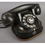 A Belgique Bell Telephone by MFG Company with rotary dial and gilt decoration.
