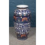 A large oriental style floor vase featuring painted floral decoration. Height 62cm.