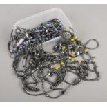 A tray containing a large quantity of hematite bead necklaces.