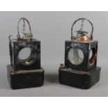 A pair of Welch Patent BR (E) railway lamps, with swing handles and hinged doors. One missing lid