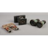 A pair of miniature opera glasses in purse, together with a Kodak pocket camera and binoculars.