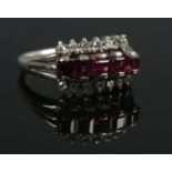 An 18ct White Gold, Ruby and Diamond three row ring. Size M. Total weight: 3.8g