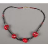 A hematite and bamboo coral necklace.