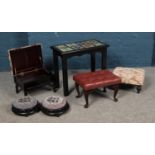 A painted tile top occasional table, together with an assortment of footstools, including beadwork