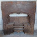 A large Victorian cast iron fireplace with floral decoration. (113cm x 102cm)