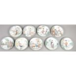 Nine Imperial Jingdezhen Porcelain cabinet plates. Depicting oriental scenes with figures.