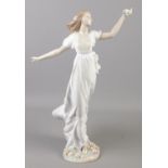 A large Lladro figure of a dancing maiden. Height 42cm. Repair to one finger and one finger