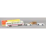 Four vintage Dinky die-cast vehicles. To include boxed 952 Vega Major, 133 Cunningham x 2 and 344.