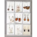 Nine pairs of silver earrings. Includes paste set, stone, pearl etc.