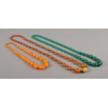 Three strings of Art Deco yellow, orange and green beads.