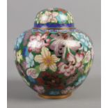 A lidded Chinese cloisonne jar, with floral decoration. 14cm high.