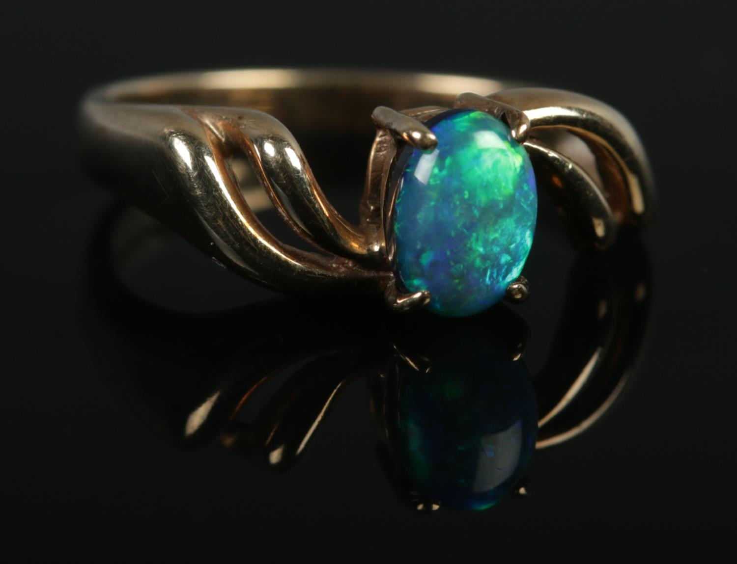 A 9ct Gold and Opal doublet ring; size MÂ½. Total weight: 2.9g.