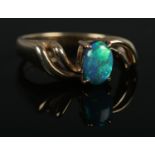 A 9ct Gold and Opal doublet ring; size MÂ½. Total weight: 2.9g.