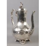 A Victorian Sheffield plate hot water pot. With bird finial and engraved decoration. Approx 25cm