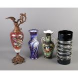 Four vases. To includes Pearl Pottery and black art glass example.