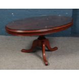 A Victorian mahogany oval table with tripod base. Possible marriage of table top and base.