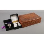 A carved jewellery box with contents of collectables. To include ingersoll pocket watch, boxed