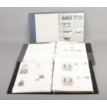 Three albums containing 75th Anniversary of the RAF stamps, an album of flown and first day