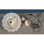 A glass and yellow metal ceiling light with similar single wall sconce. Also floral table lamp,