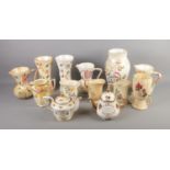 A quantity of Arthur Wood ceramics including commemorative teapot, jugs and vases. Approx. 13