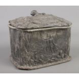 A Victorian lead box and cover with decoration depicting scenes from the Crimean War. Stamped