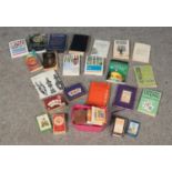 A large collection of playing cards, tarot card and fortune telling guides. To include I Ching