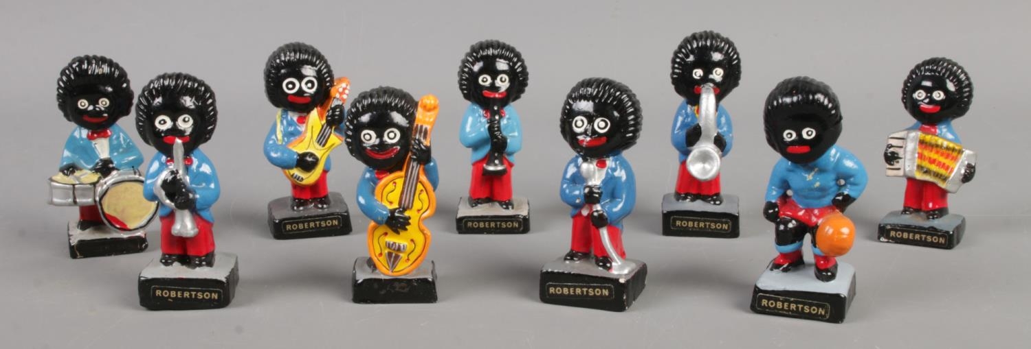 Nine Robertson Golly figures mainly depicting band members. To include singer, accordion player