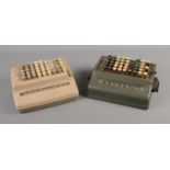 Two vintage Plus desktop mechanical adding machines.