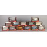 A collection of thirteen Exclusive First Editions 1:76 scale model buses in boxes. To include