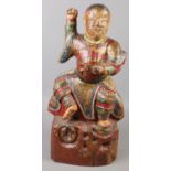 A carved painted wooden figure of a Chinese immortal. (46cm)