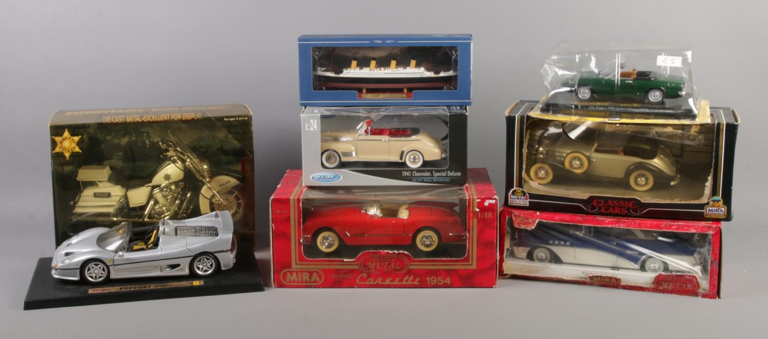 A collection of assorted scale model vehicles, some boxed. To include Maisto Ferrari F50 on