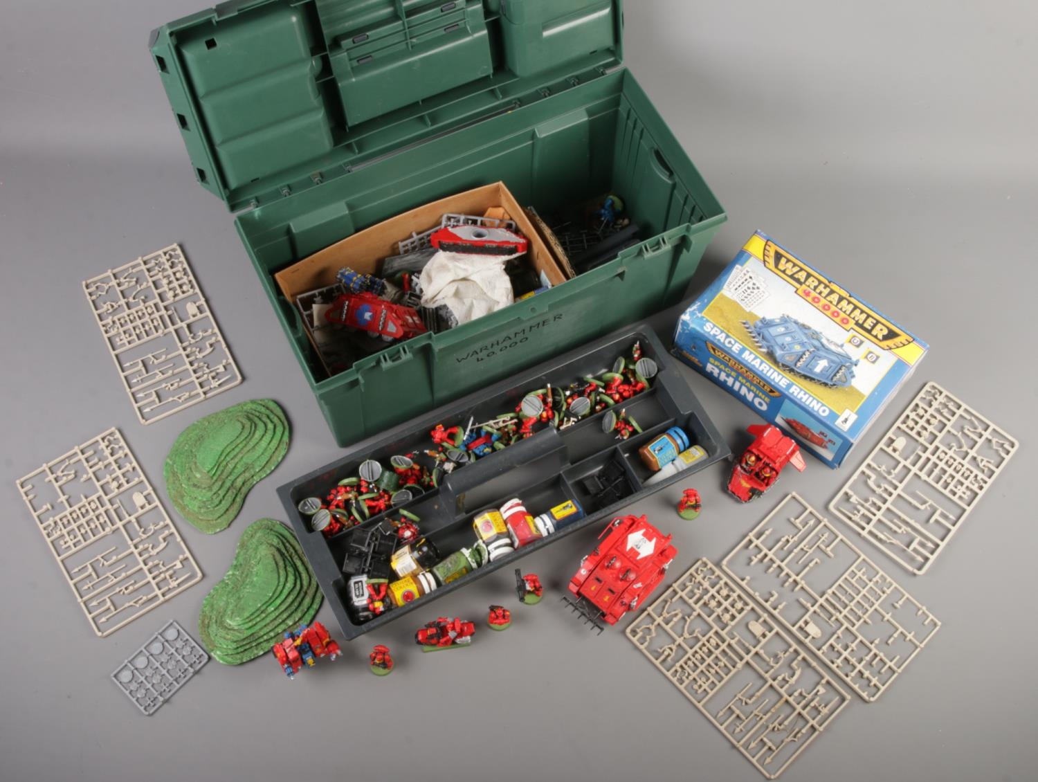 A box of Warhammer 40,000 accessories. Including figures, tanks, etc.
