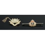 A 9ct Gold Royal Navy sweetheart brooch (5.4g), tgoether with 9ct Gold Royal Navy crest on silver