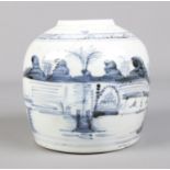 A 19th century Chinese ginger jar decorated in underglaze blue with landscape scenes.
