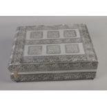 A white metal velvet lined jewellery box featuring floral decoration and fitted interior. Approx.